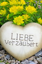 Heart of stone with the inscription Liebe verzaubert