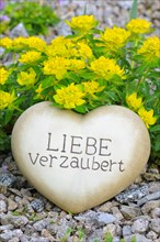 Heart of stone with the inscription Liebe verzaubert