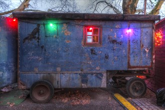 Old construction wagon with coloured chain of lights