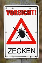Warning sign Caution ticks