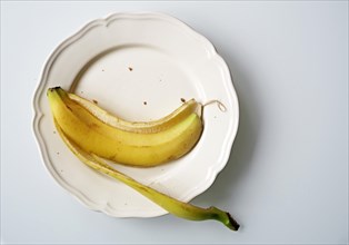Empty banana peel on a plate