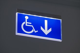 Blue sign for wheelchair users