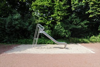 Lonely children's playground with slide and sandpit without children