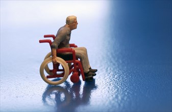 Toy figure as wheelchair user