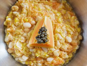 Boiled corn with papaya and chickpeas