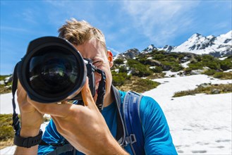 Young man photographing