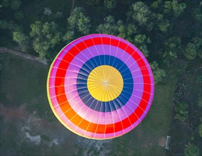 Colorful hot air balloon in the air from above