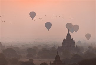 View of pagodas with hot air balloons