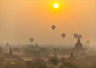 View of pagodas with hot air balloons