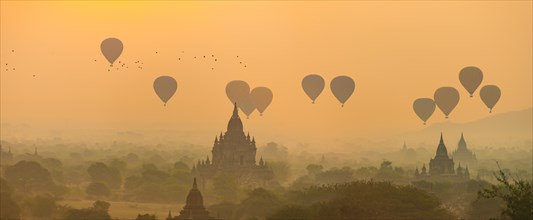 View of pagodas with hot air balloons