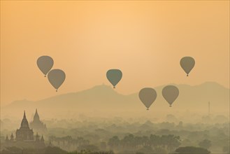 View of pagodas with hot air balloons