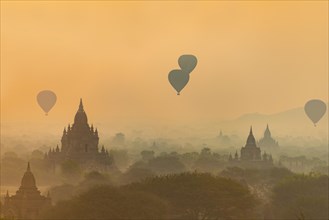 View of pagodas with hot air balloons