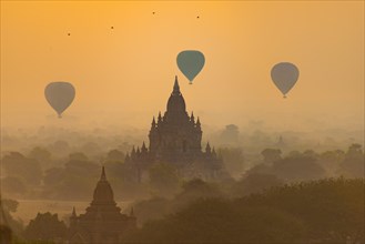 View of pagodas with hot air balloons