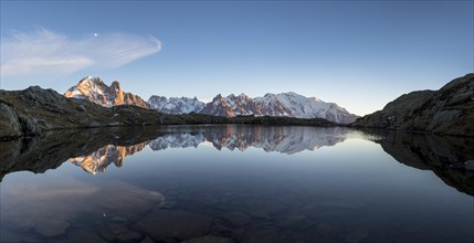 Panorama of Mont Blanc massif with reflection in the Lac des Chesery