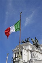 Italian flag in front of the National Monument Vittorio Emanuele II