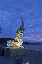 Dragon fountain at night on the promenade in Songkhla