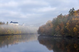 Burgk Castle in morning fog on the Saale river