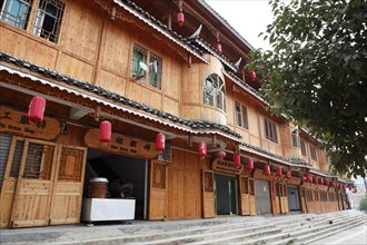 Traditional wooden house with Chinese shops in the Miao village