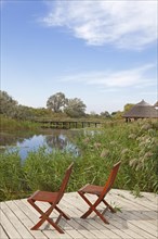 Two chairs on viewing platform at the lagoon