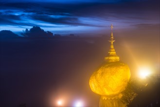 Illuminated Golden Rock at night with Kyaiktiyo Pagoda