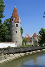 City wall and towers by the river Abens