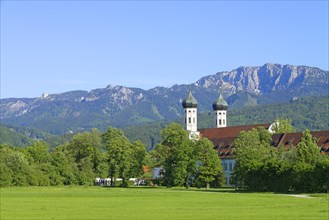 Benediktbeuern Abbey against Benediktenwand mountain ridge