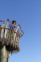 Girl standing on lookout tower at Cape Kamenjak