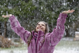 Girl enjoying the snowfall