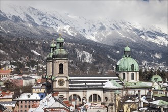 View from the town tower onto the city with the cathedral and the Karwendel Mountains