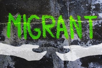 Graffiti on migration reading migrant