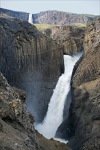 Waterfall Litlanesfoss between basalt columns