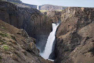 Waterfall Litlanesfoss between basalt columns