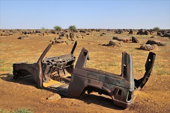 Wreck of an SUV in the desert