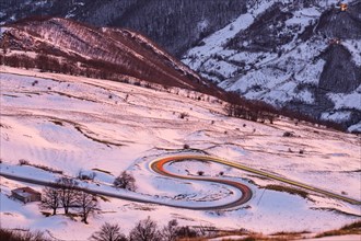Hairpin turns and light trails of a car