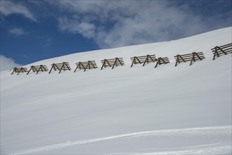 Avalanche control on the mountain slope with snow