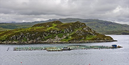 Salmon fish farm in a bay at the Scottish coast