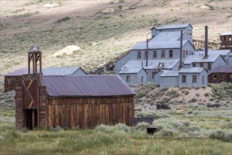 Old mining building behind old wooden houses