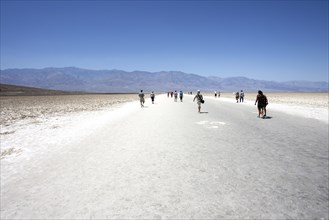 People walking Badwater Basin salt pan