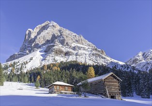 Mountain hut in front of Peitlerkofel with snow