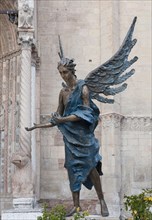 Blue angel in front of Verona Cathedral