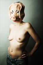 Naked woman with pig mask