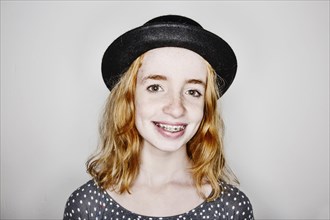 Girl with hat and braces