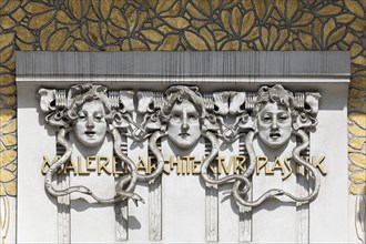 Three women's faces on the Secession building for Contemporary Art