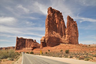 Road in Arches National Park passing the Organ and the Courthouse Towers on the right