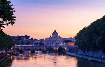 Saint Peter's Basilica with Sant' Angelo's Bridge over Tiber at sunset
