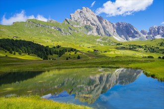 Seceda peak reflected in Lech Sant or Holy Lake