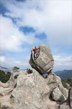 Young man standing in a rock formation