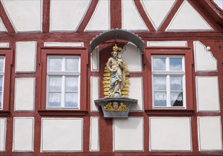 Madonna figure on a half-timbered house