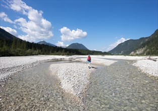 Woman trekking on gravel