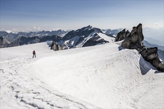 Mountaineer on Schwarzenstein summit ridge
